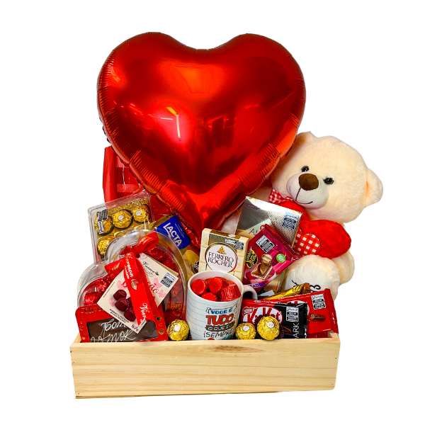 cesta romantica com uma grande variedade de chocolates, com pelucia e balão de coração.